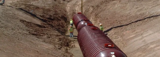 Large utilities pipe being installed.